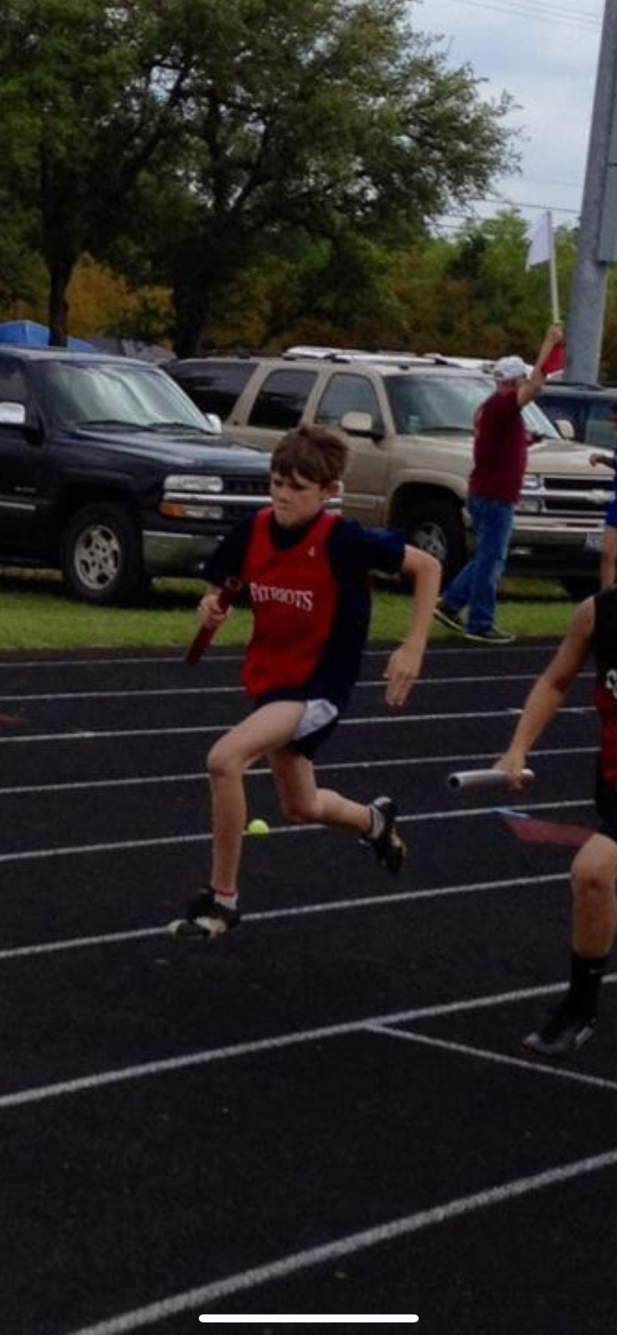 A young Isaiah Hudgens running a relay for the FEAST Patriots
