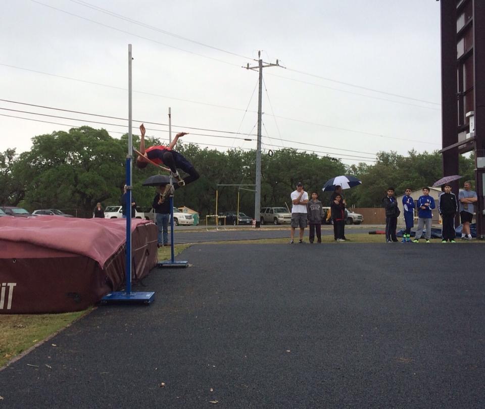 A young Isaiah Hudgens clearing the high jump bar